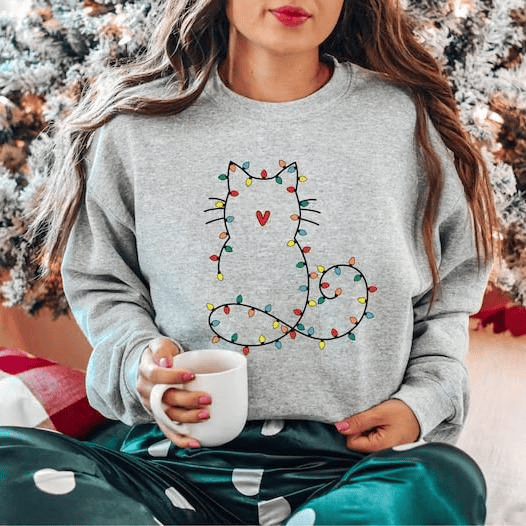 Adorable cat Christmas sweatshirt for women, perfect gift for cat lovers, featuring festive holiday design and cute Xmas graphic for cozy winter days